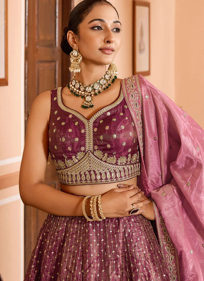 Rose gold tissue silk engagement lehenga with zari embroidery