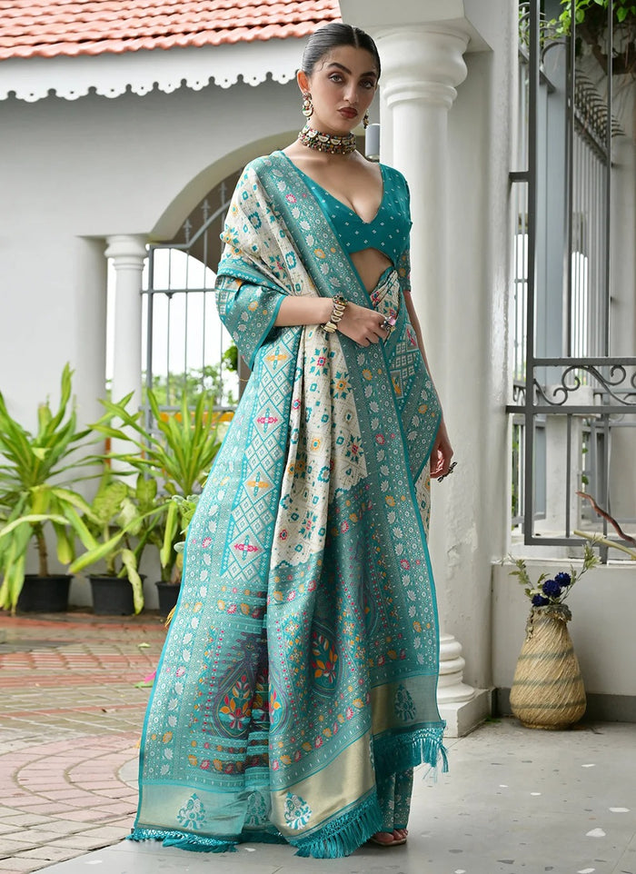 Sea green Banarasi silk Patola saree with Ajrakh zari weaving