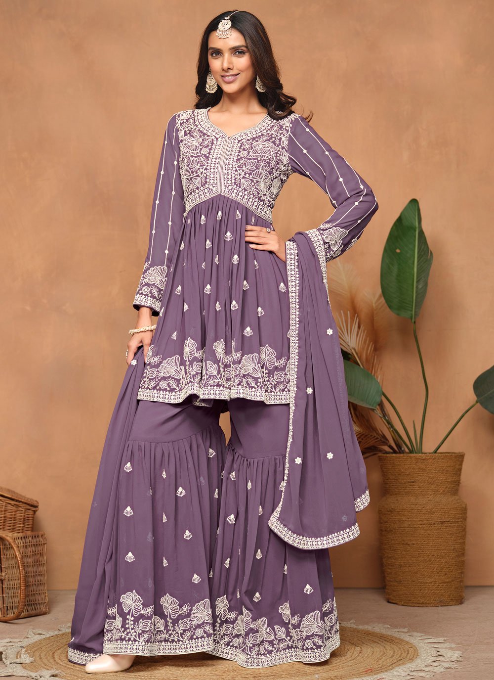 Elegant Purple Embroidered Sharara Style Suit in Faux Georgette