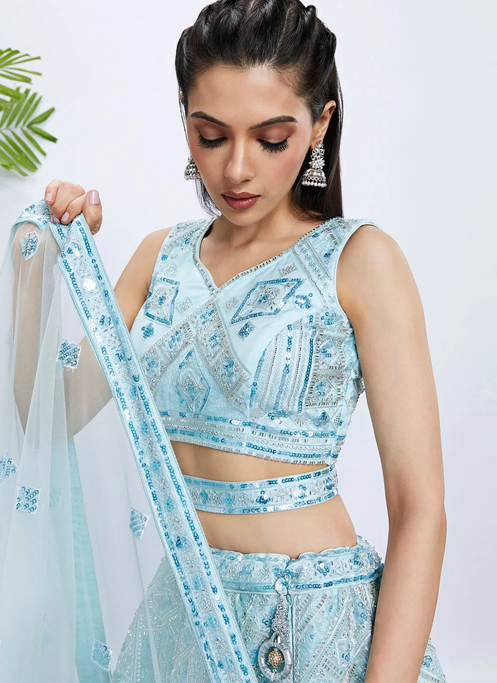 Elegant Turquoise Blue Net Engagement Lehenga With Intricate Cutdana & Sequins Work