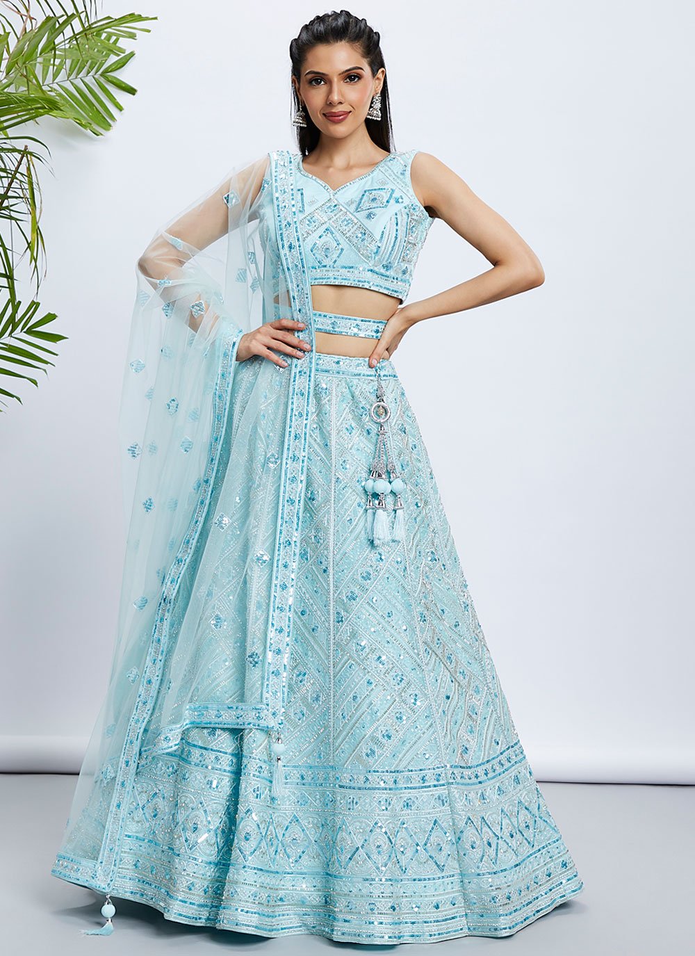 Elegant Turquoise Blue Net Engagement Lehenga With Intricate Cutdana & Sequins Work