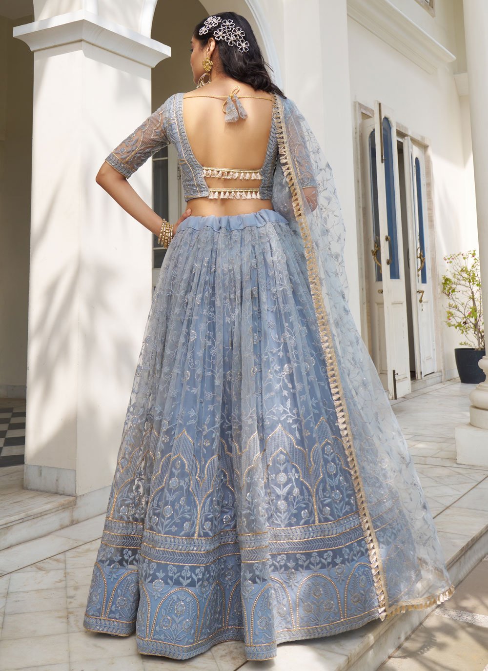 Enchanting Light Blue Grey Butterfly Net Party Wear Lehenga