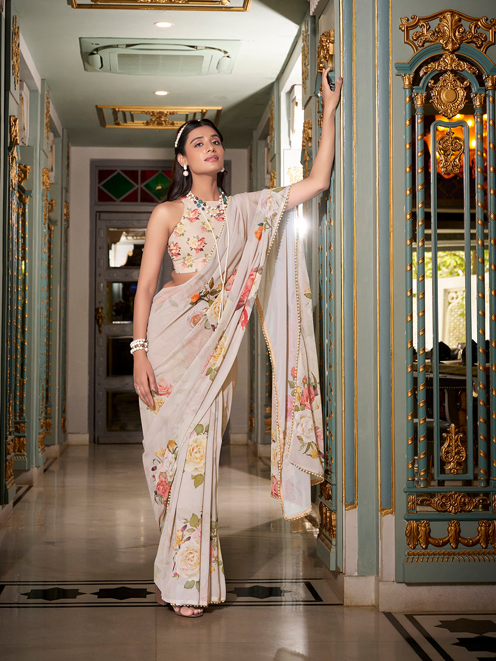 Off white georgette saree with pearl lace border