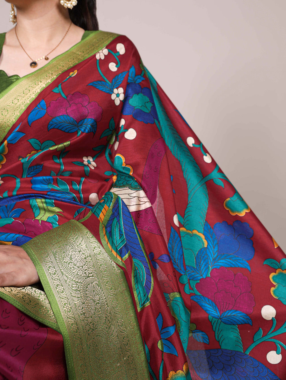 Maroon saree with green blouse piece