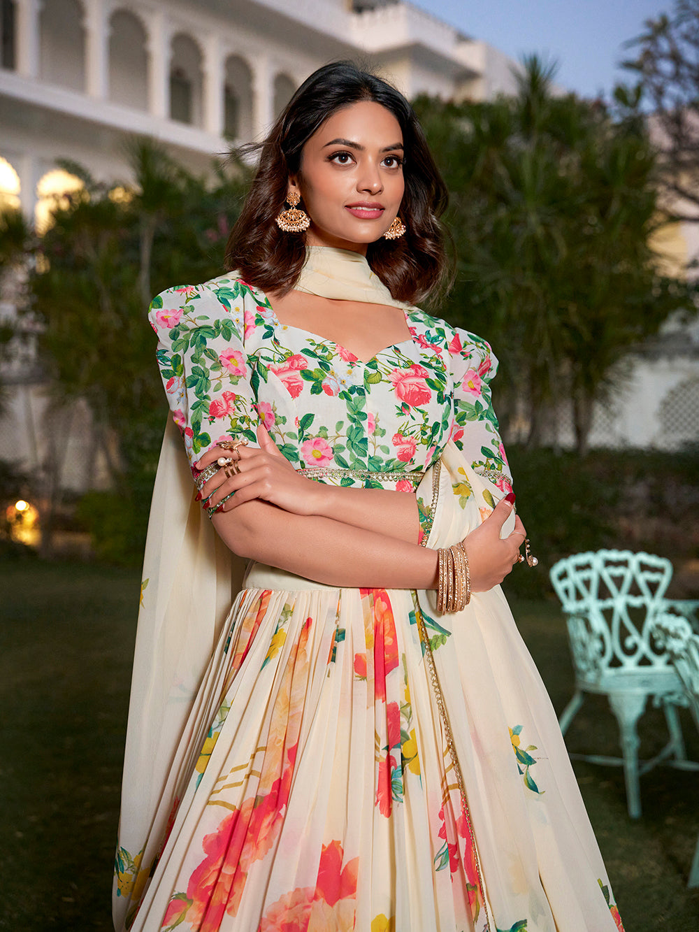 Woman wearing a floral dress with a blurred outdoor background