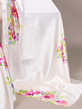 White fabric with colorful floral patterns on a neutral background