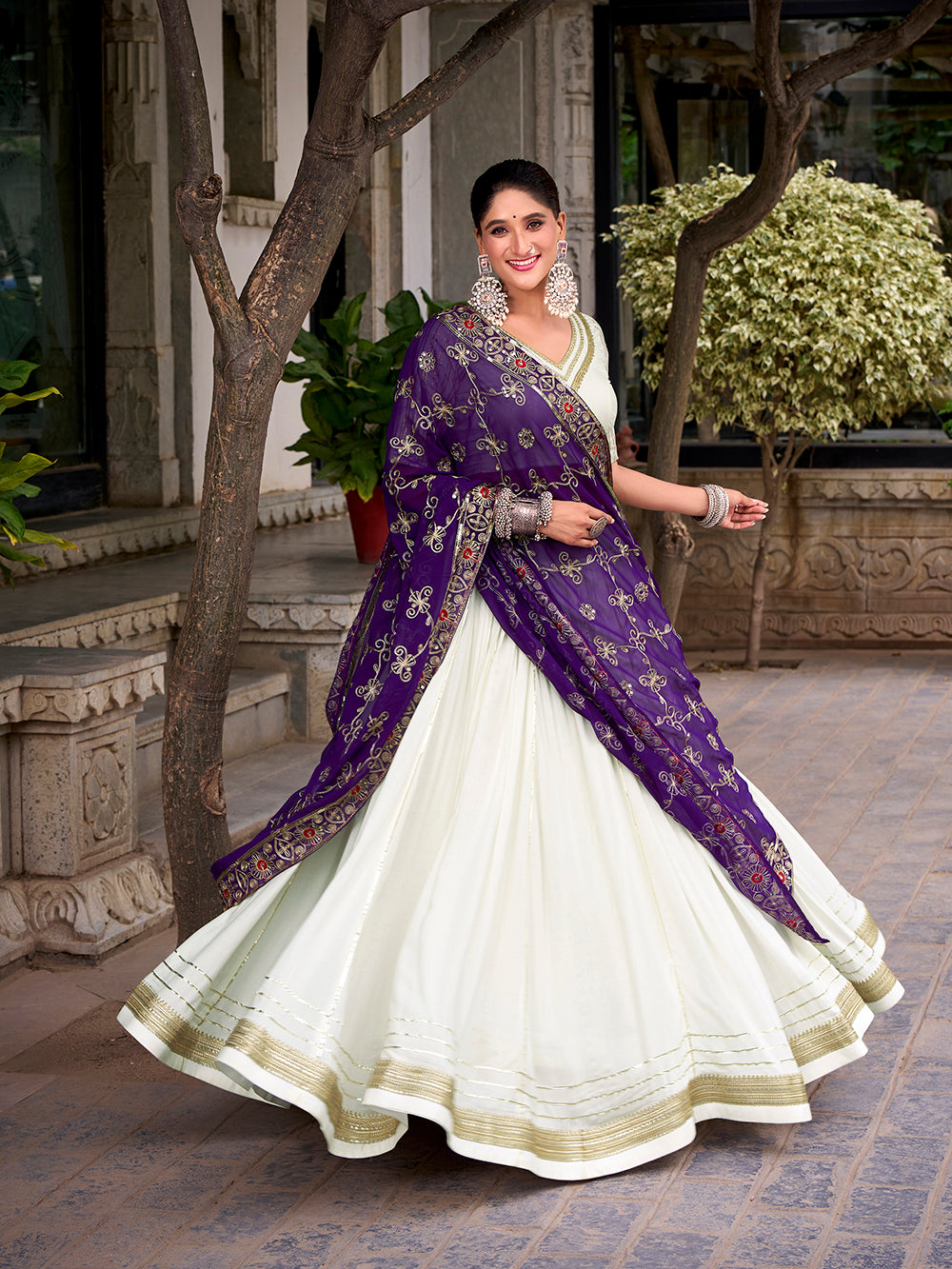 White lehenga with lace touch up and zari blouse