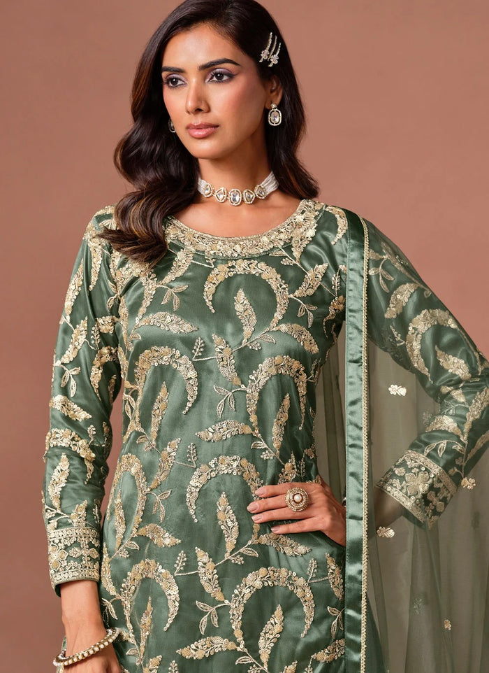 Green palazzo salwar suit featuring embroidery, sequins and zari work