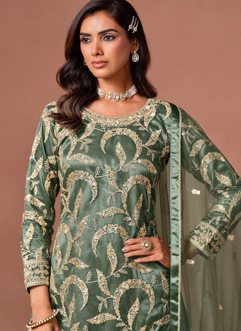 Green palazzo salwar suit featuring embroidery, sequins and zari work