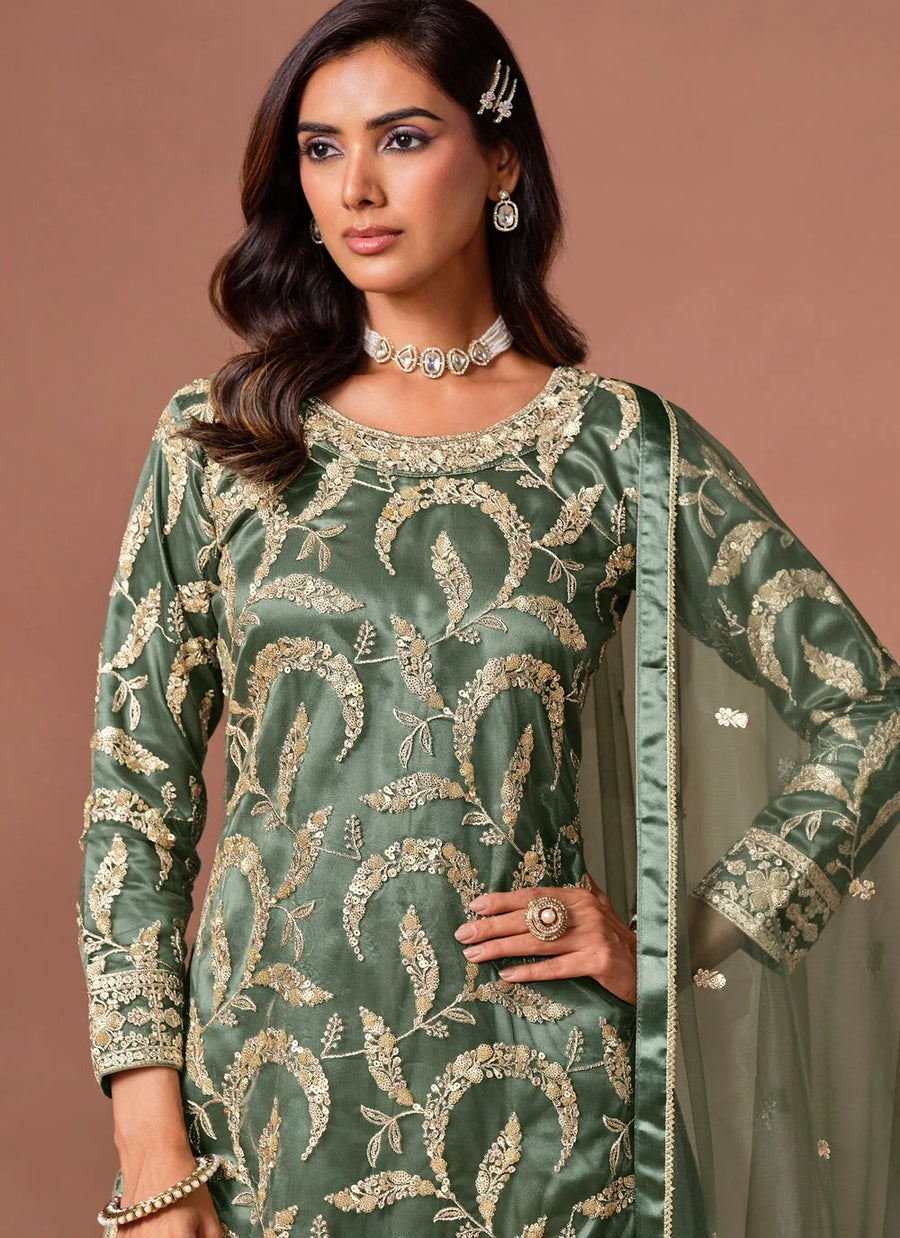 Green palazzo salwar suit featuring embroidery, sequins and zari work
