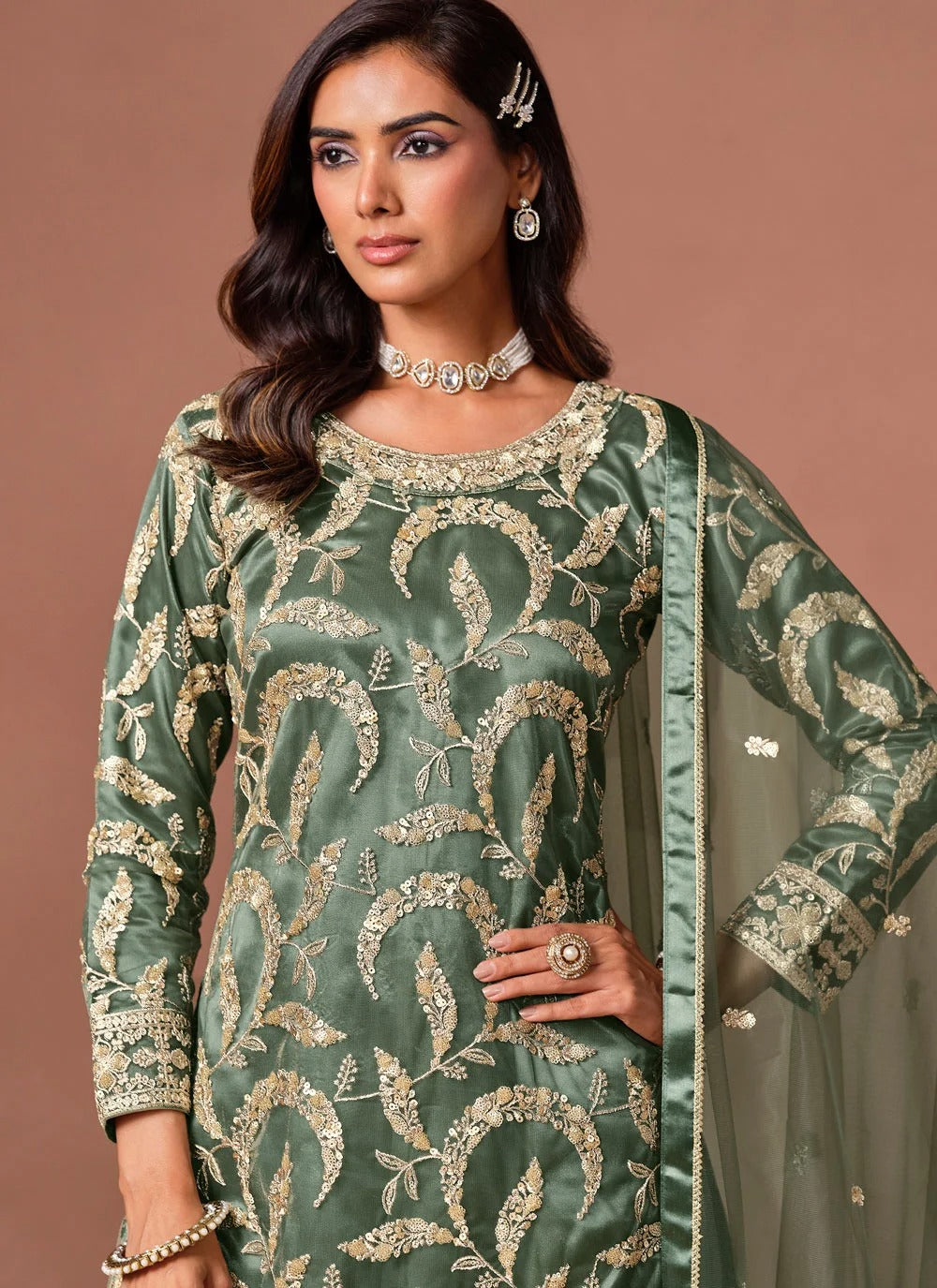 Green palazzo salwar suit featuring embroidery, sequins and zari work