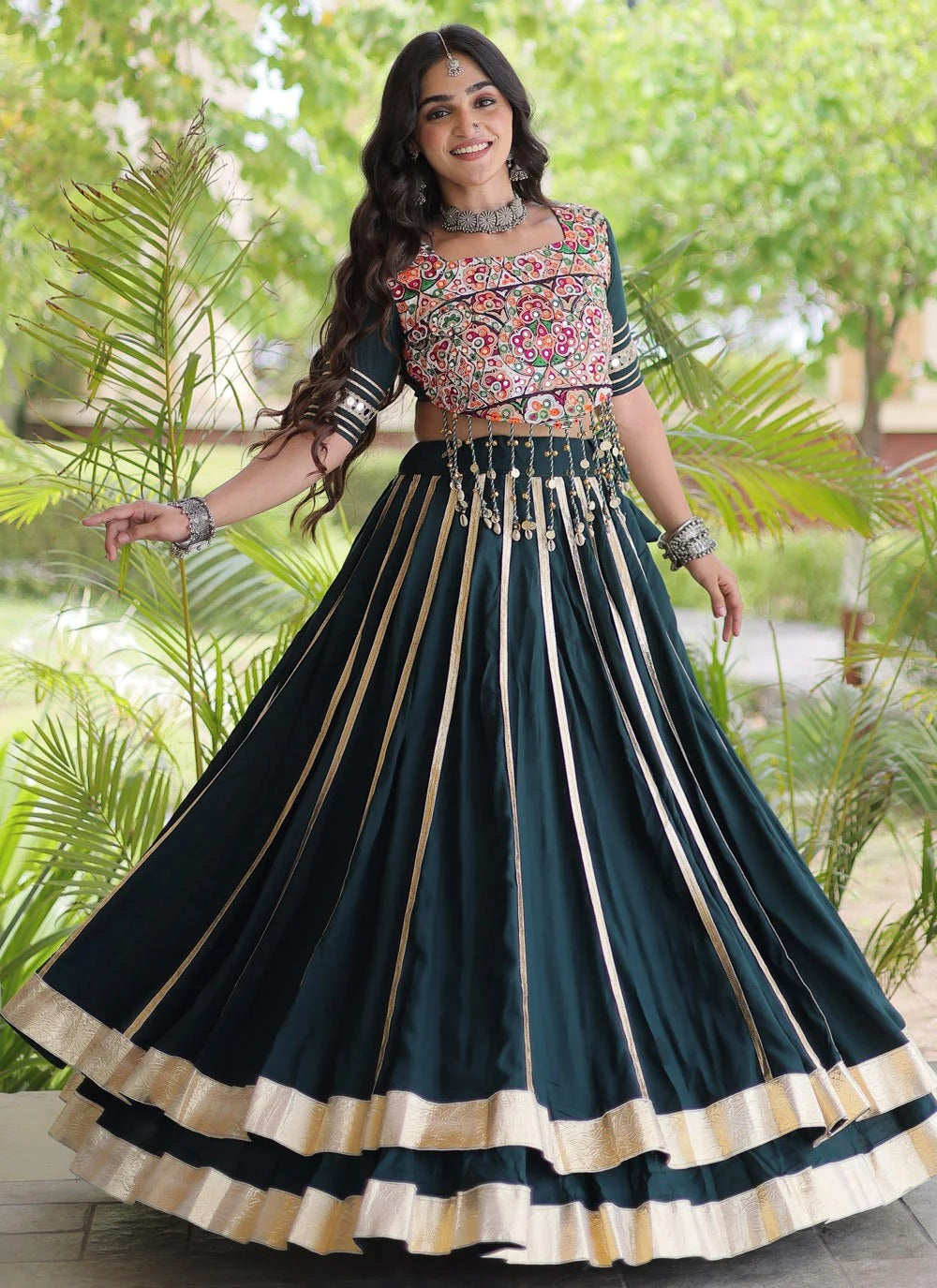 Green Gamthi mirror work lehenga with Gota Patti lace and 5-metre flair