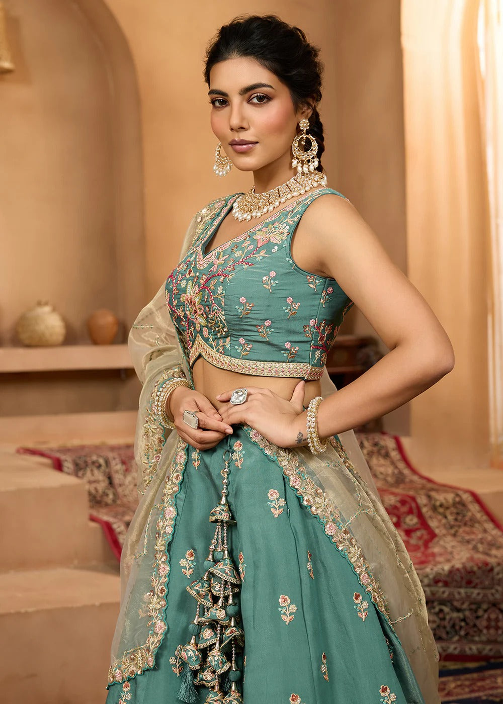 Green georgette lehenga choli with heavy sequins, stone work and organza dupatta