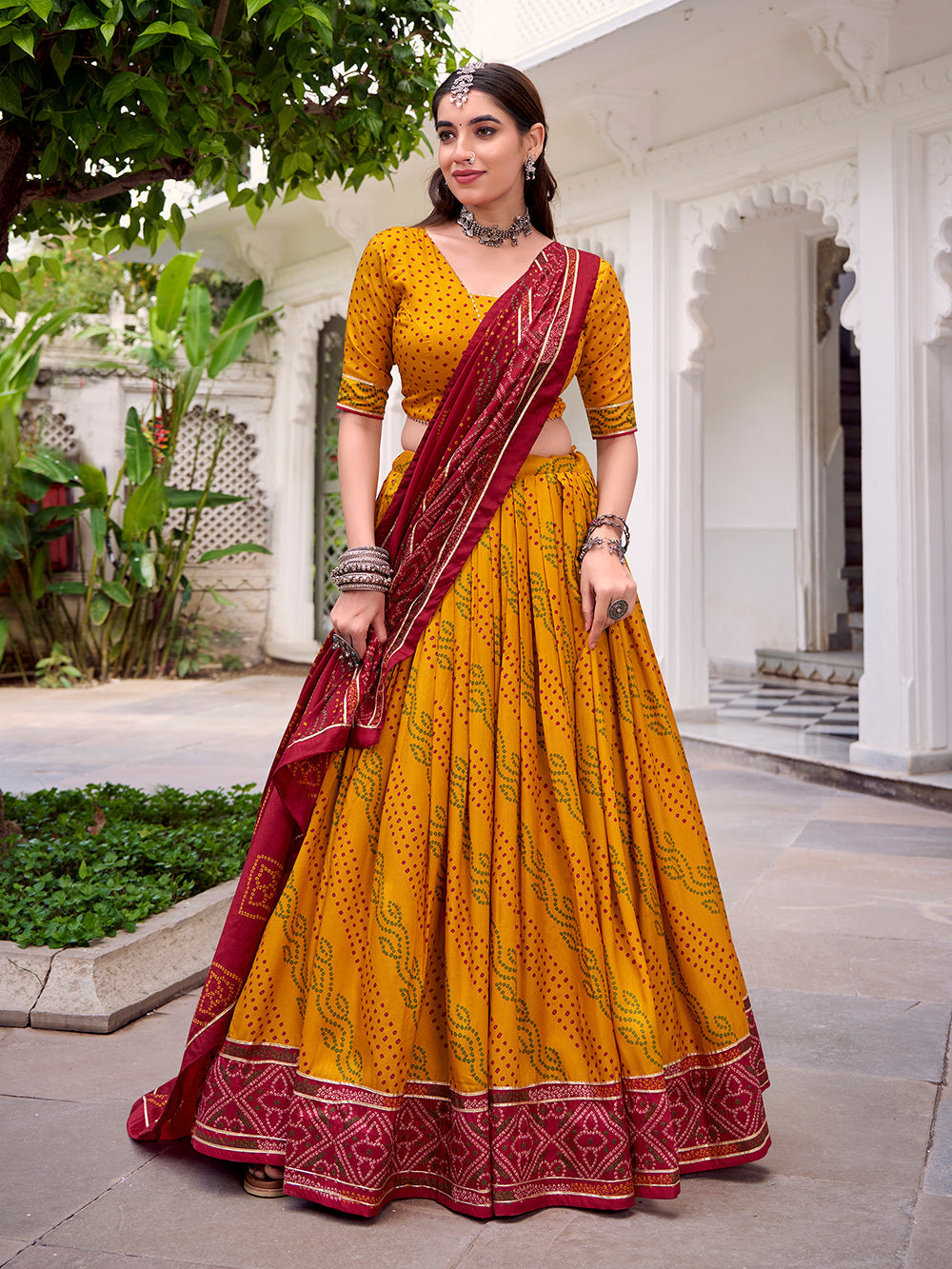 Yellow bandhej lehenga with gotta patti lace