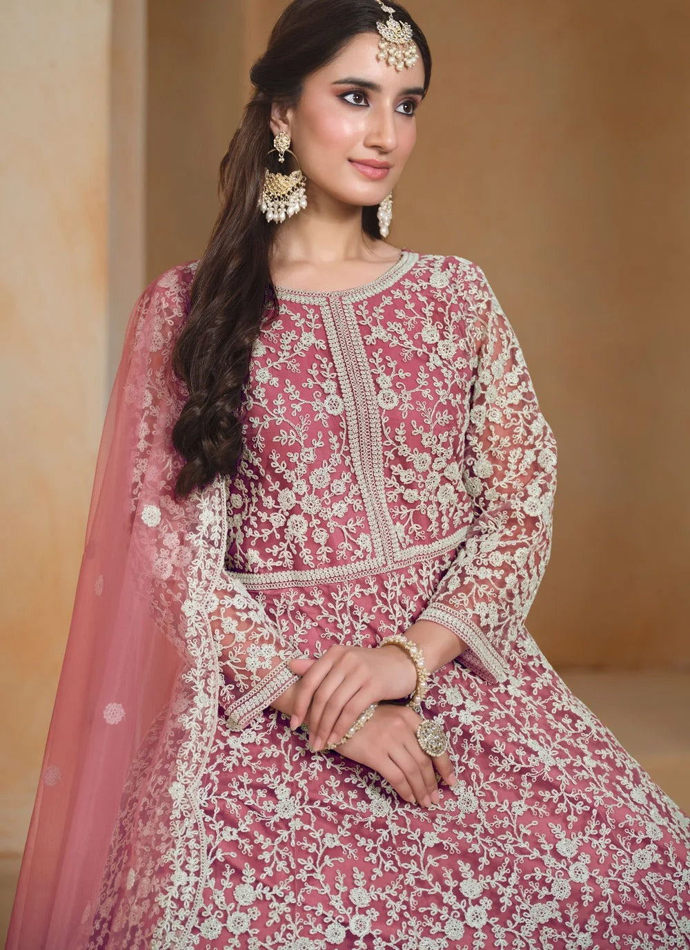 Hot Pink Designer Anarkali Suit in premium net fabric with elegant thread embroidery and matching net dupatta.