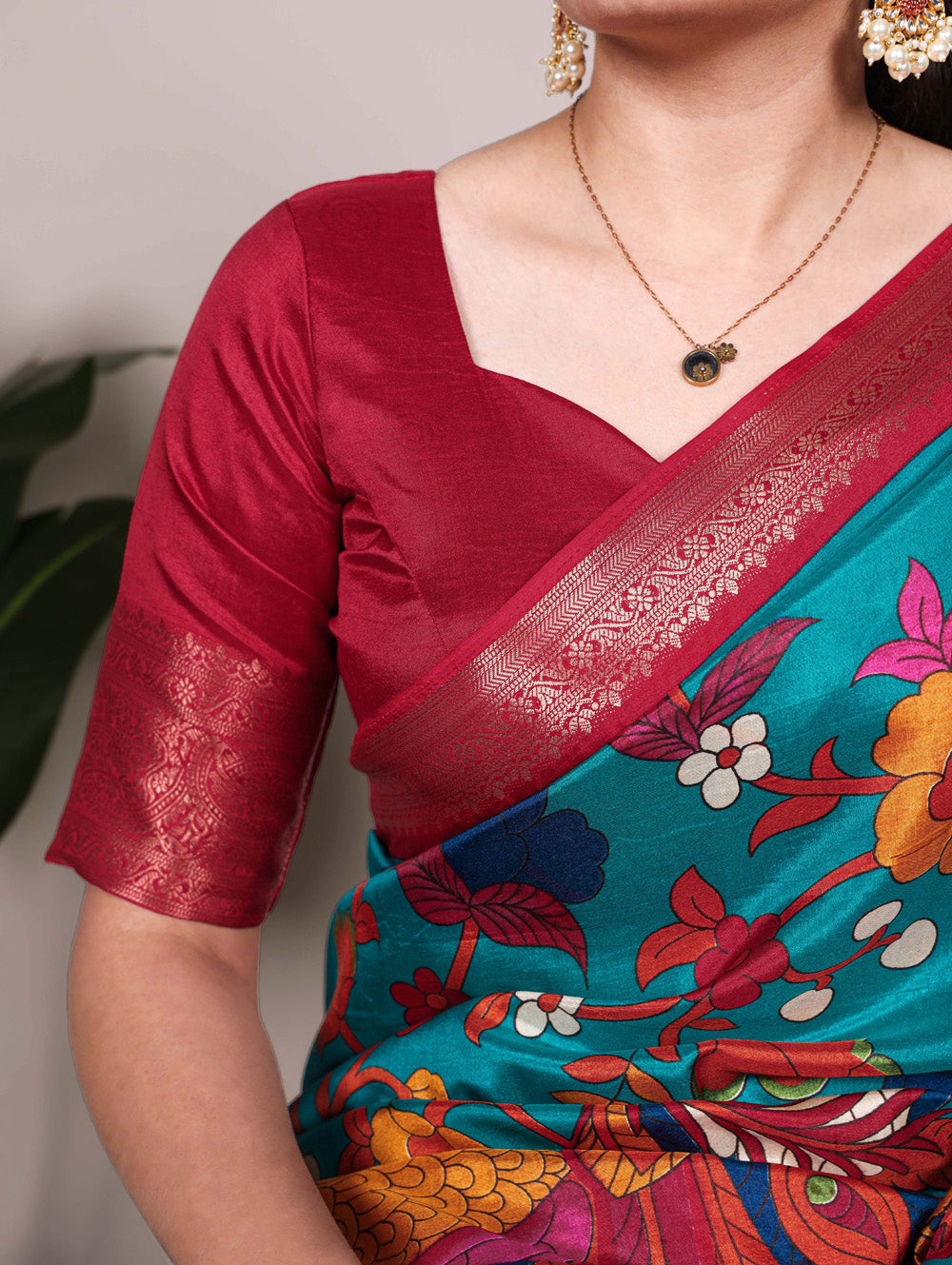 Firozi saree with maroon blouse