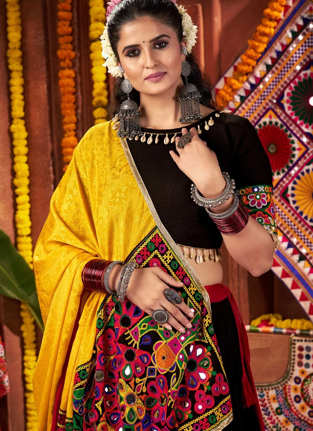 Woman in traditional Indian attire with a colorful background