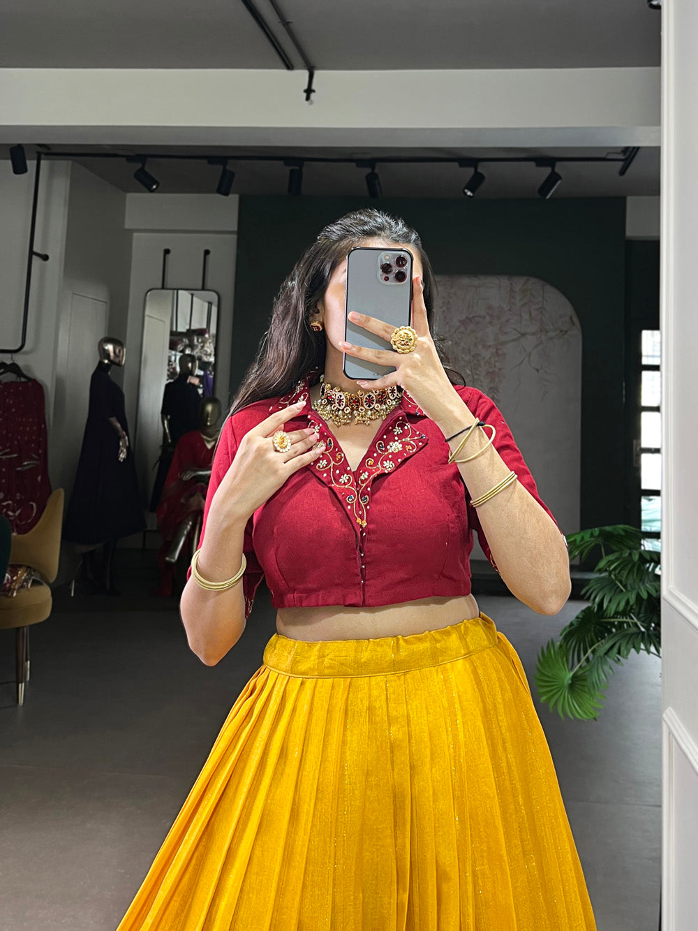 Close-up of mustard lehenga showing zari weaving and traditional printed work with matching cotton hand work blouse