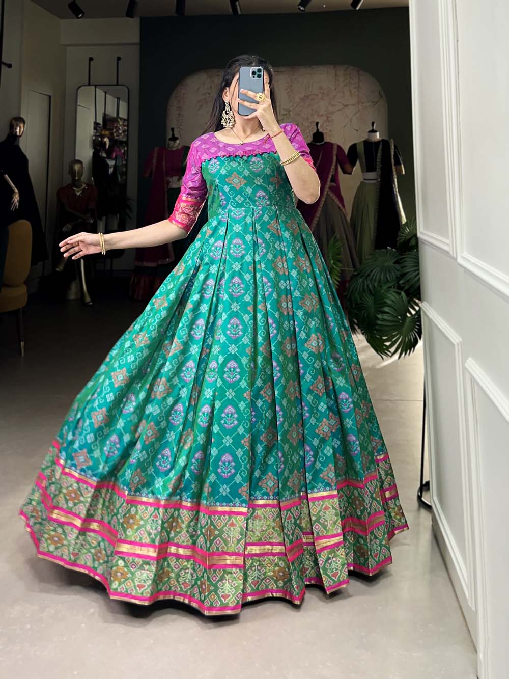 Bottle Green Color Jacquard Silk Patola Print With Zari Weaving Work Gown