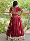 Maroon Navratri chaniya choli with Gamthi mirror work and flared lehenga