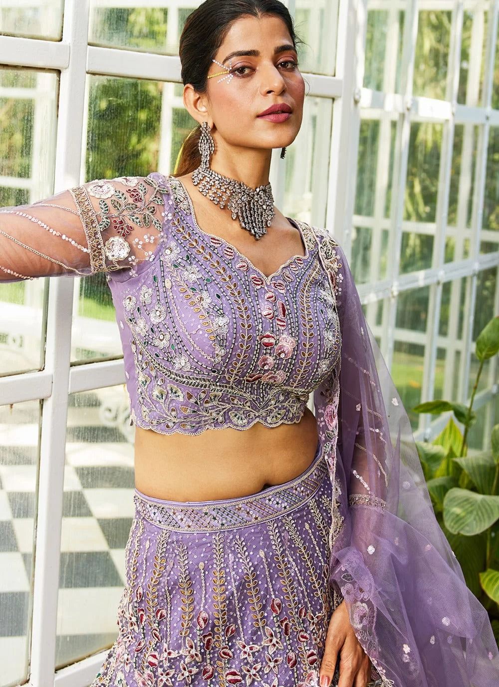 Mauve net dupatta with ethnic sequin motifs and embroidered border