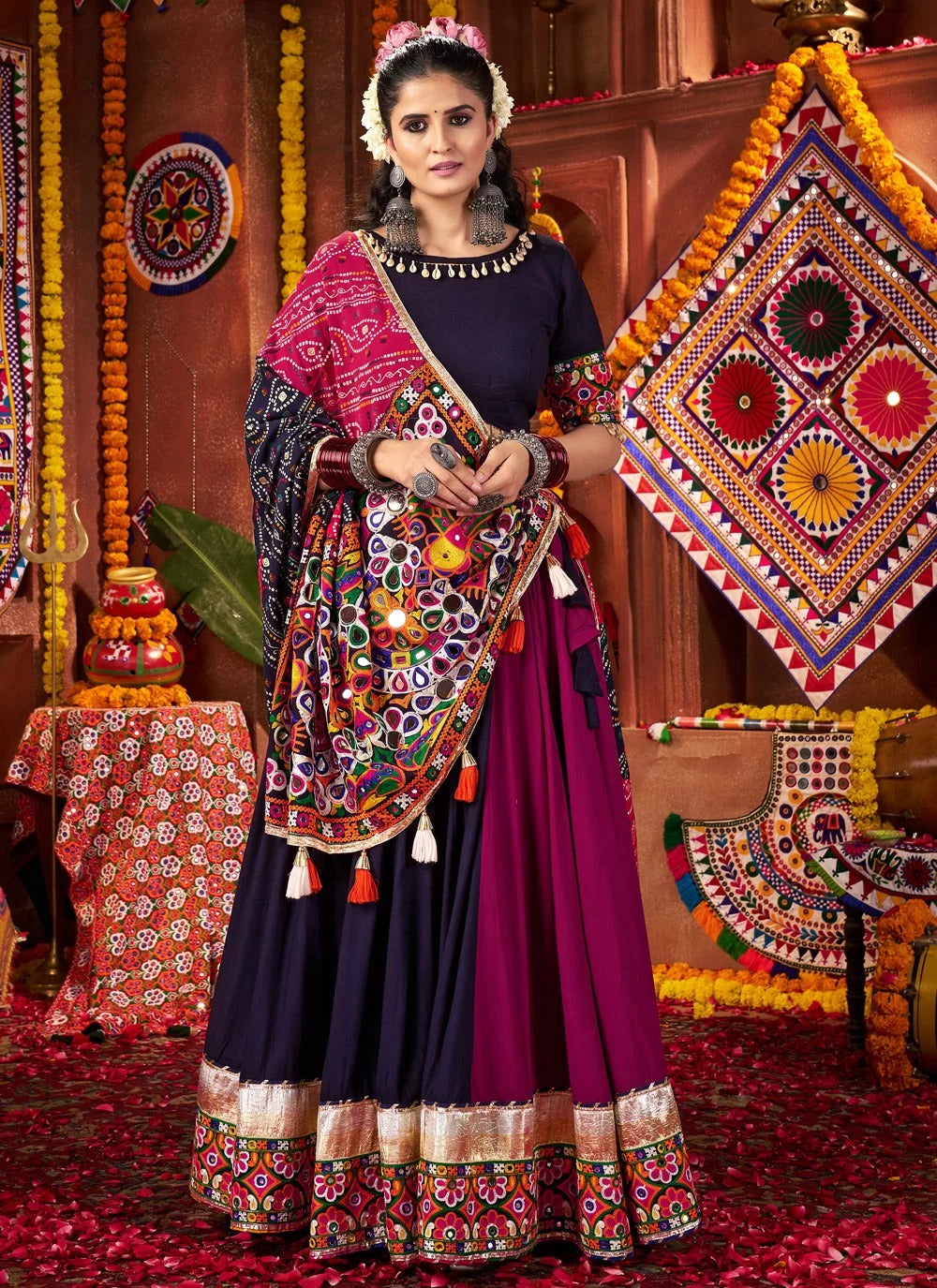 Woman in traditional attire with a colorful backdrop