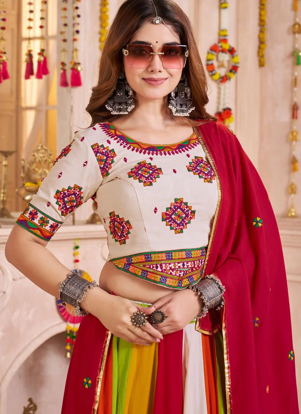 Beige mirror work choli with red dupatta for Navratri dress