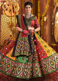 Woman in a traditional embroidered outfit with a decorative background