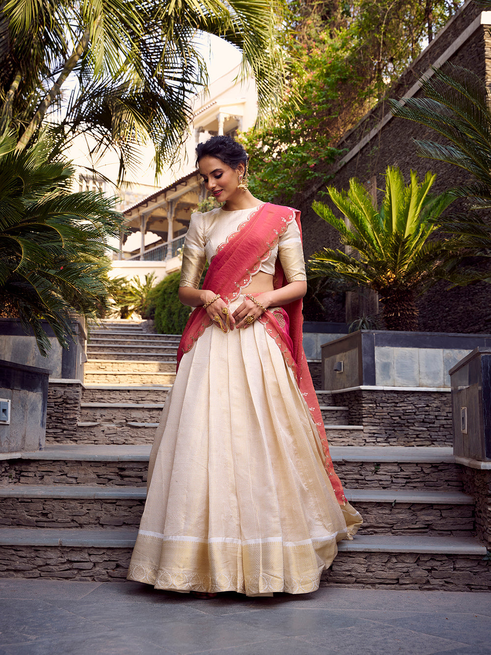 Off-white jacquard silk lehenga with golden zari weave