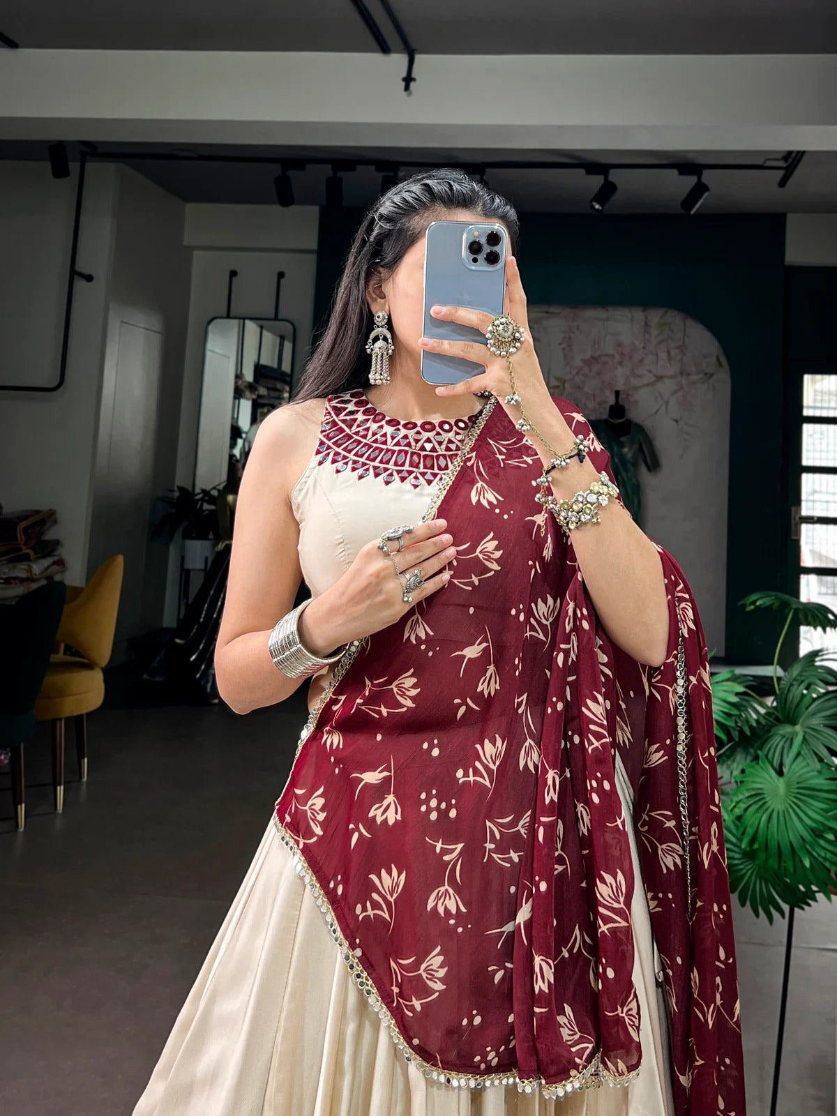Off white Navratri Garba lehenga with mirror work blouse and Satin Chiffon dupatta