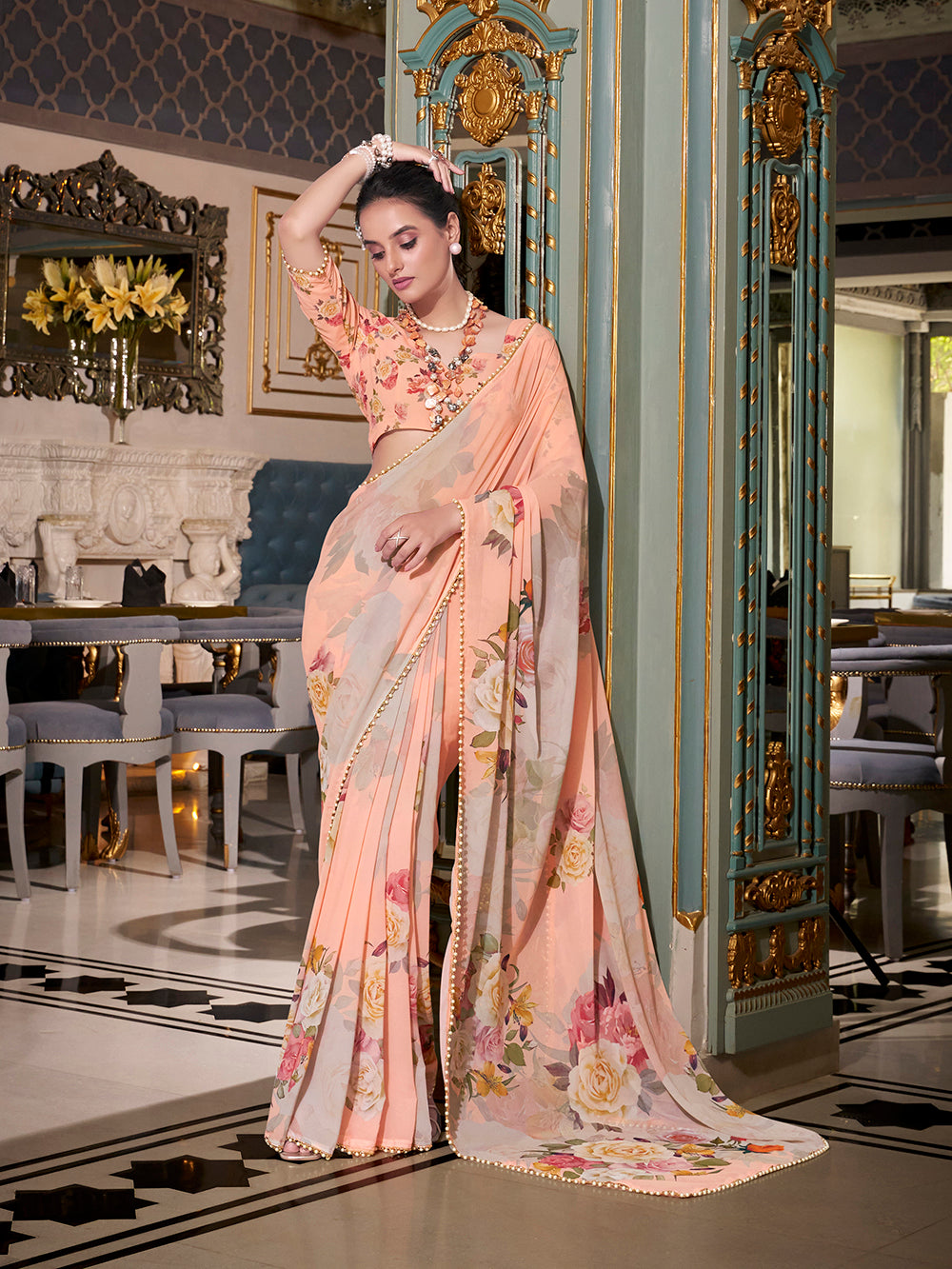 Peach georgette saree with pearl lace border