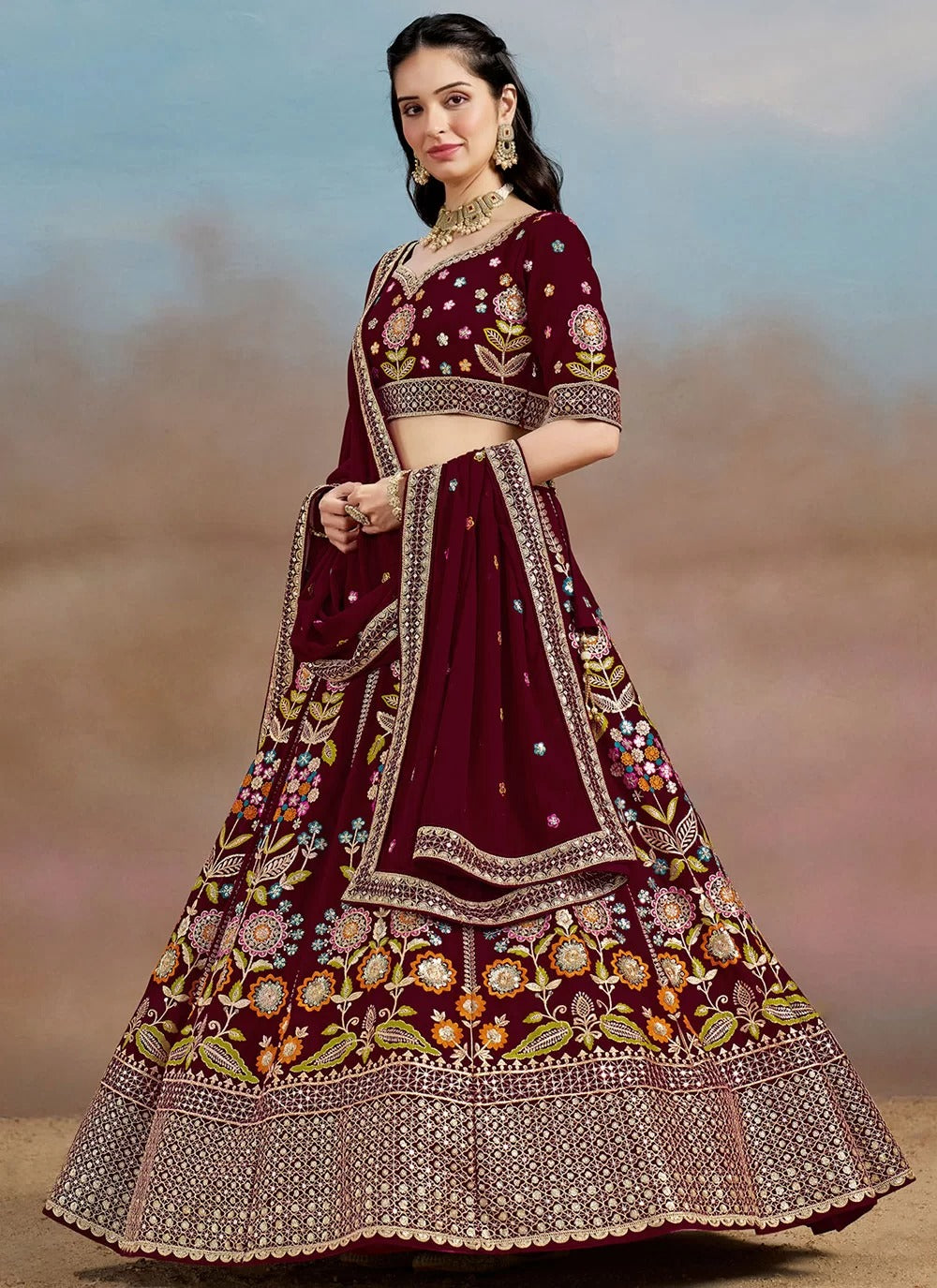 Maroon georgette sangeet bridal lehenga with sequins, zari, dori and multicolor thread embroidery