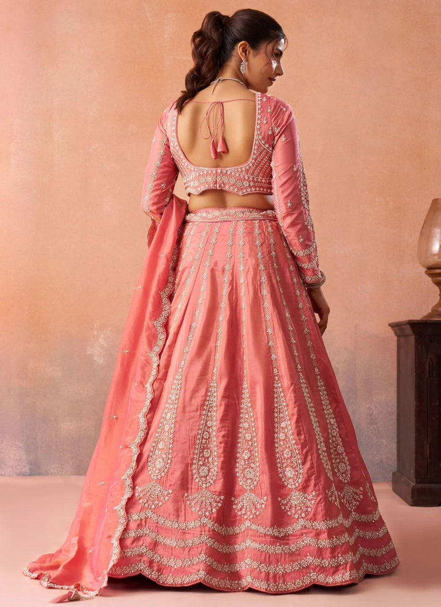 Peach tissue lehenga with floral embroidery, heavy beads and sequins work for wedding celebrations