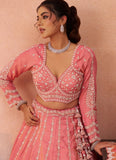 Premium peach tissue wedding lehenga featuring a white cutwork border and elegant latkan tassels
