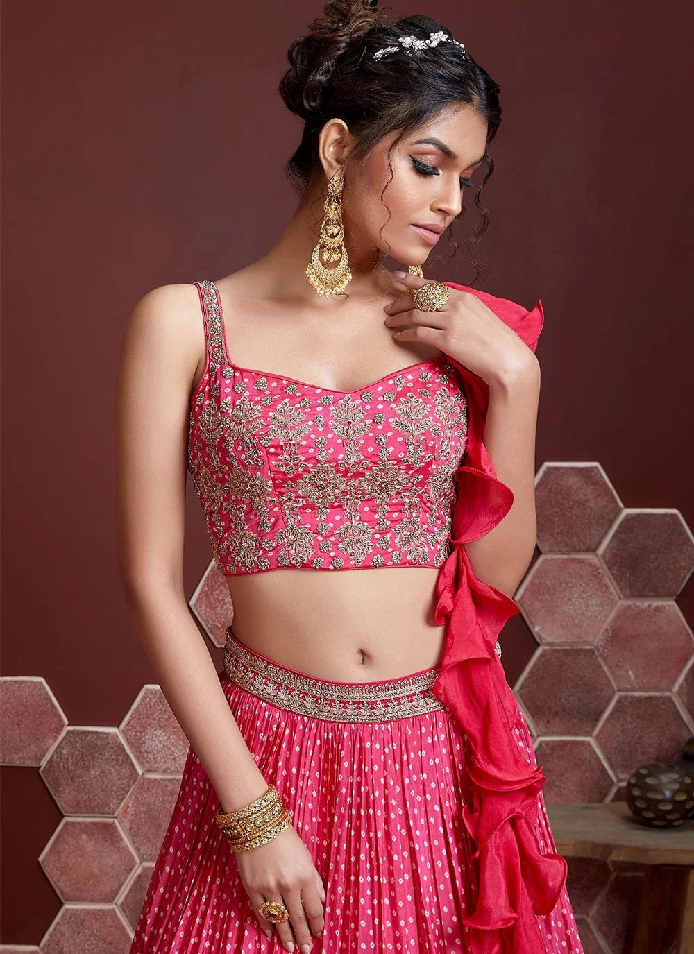 OMBRÉ PINK TO PINKISH PURPLE GEOMETRIC GOLD PATTERNED LEHENGA SET WITH AN  EMBROIDERED TIE UP BLOUSE PAIRED WITH A MATCHING SHADED DUPATTA AND GOLD  BUTIS. - Seasons India