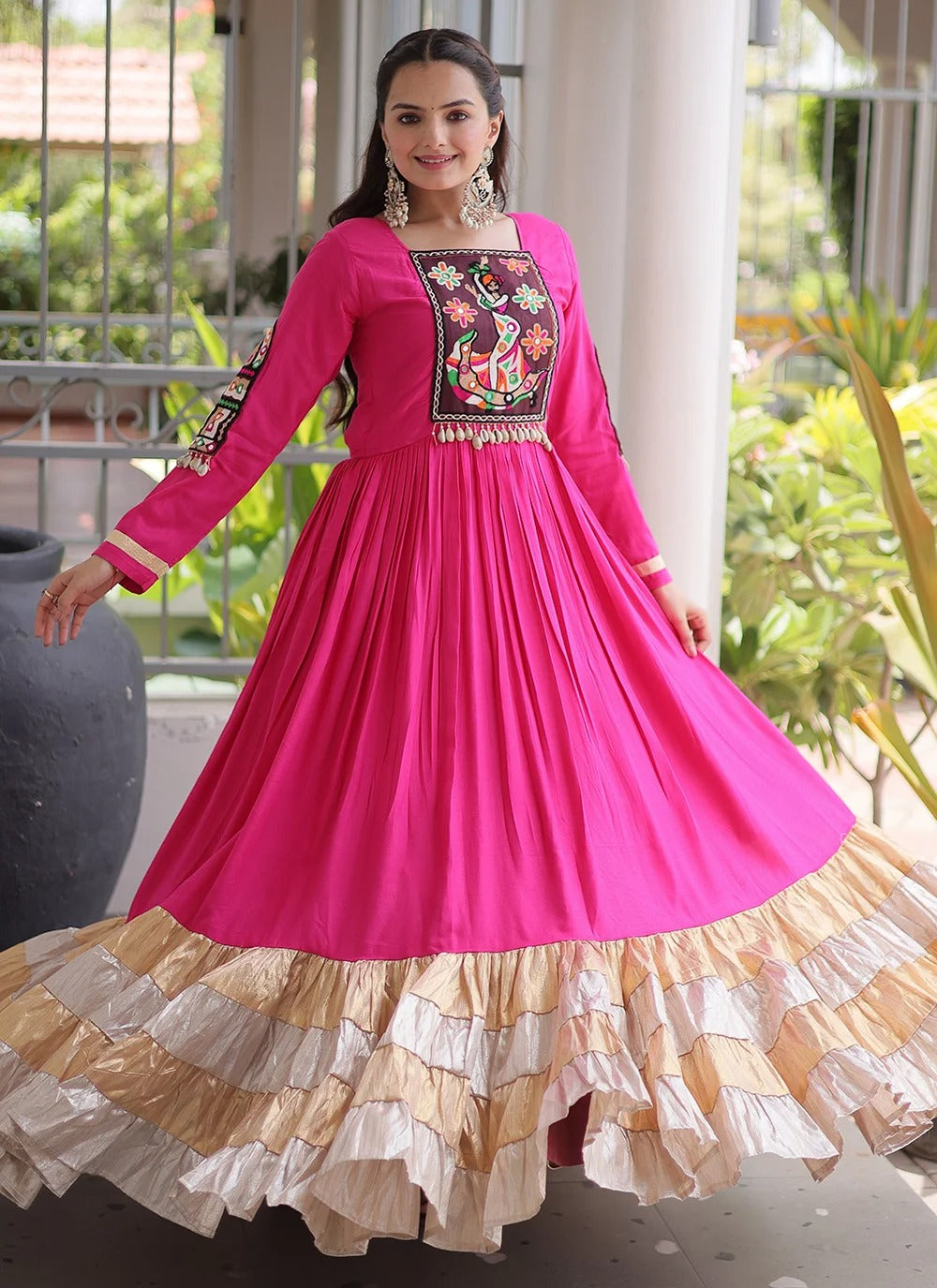 Pink Navratri gown with Kutchi Gamthi thread work and 12 metre flair