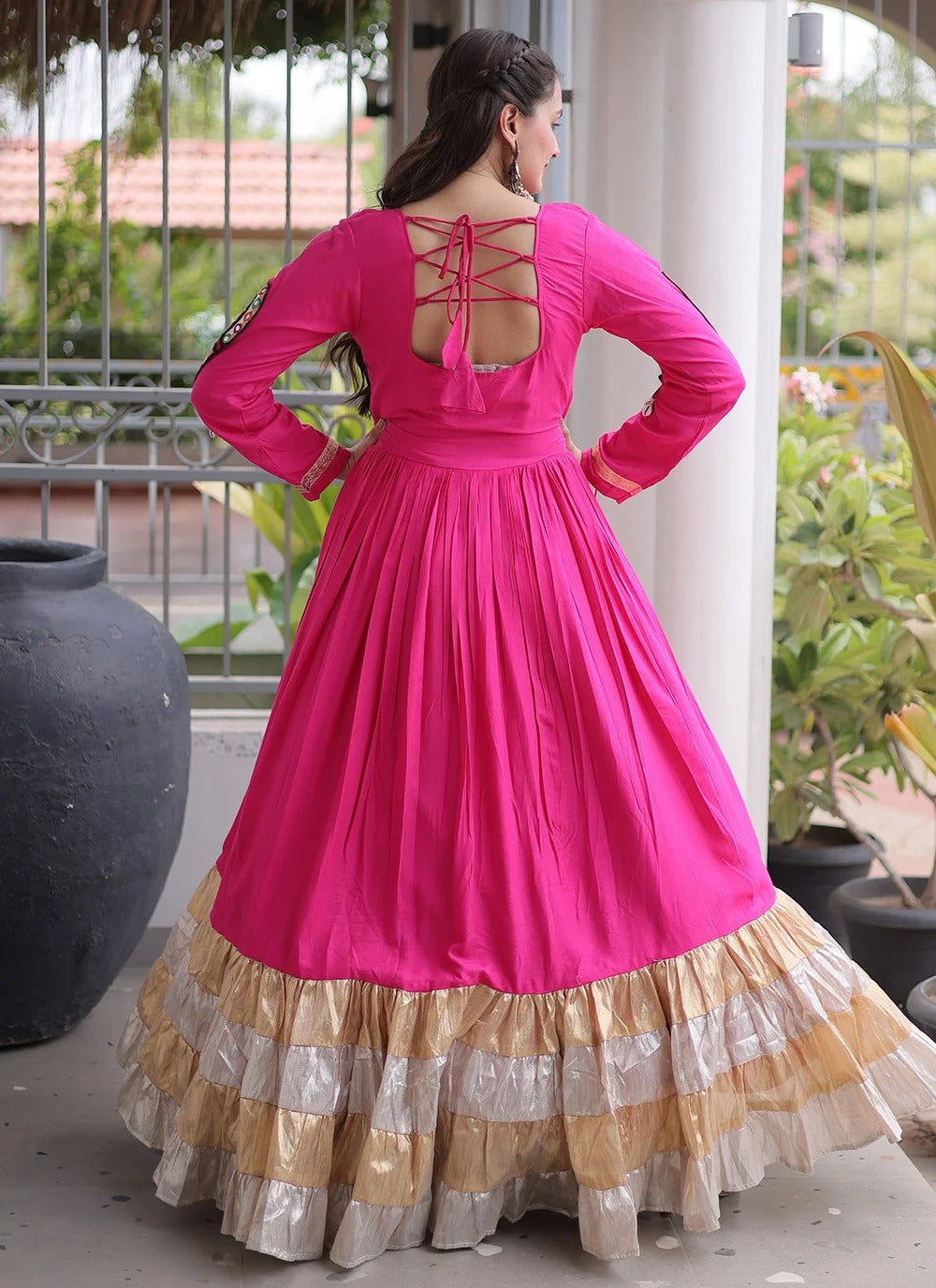 Pink traditional Navratri gown with Gamthi work and four layered flared stitching
