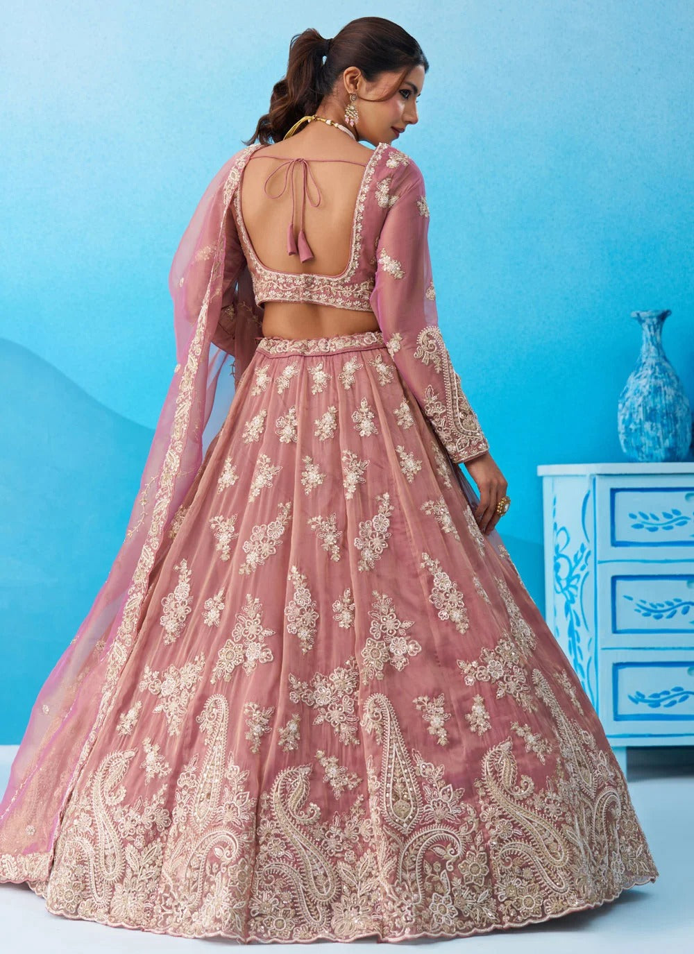 Designer pink tissue lehenga set with embroidered sweetheart blouse and matching cutwork dupatta