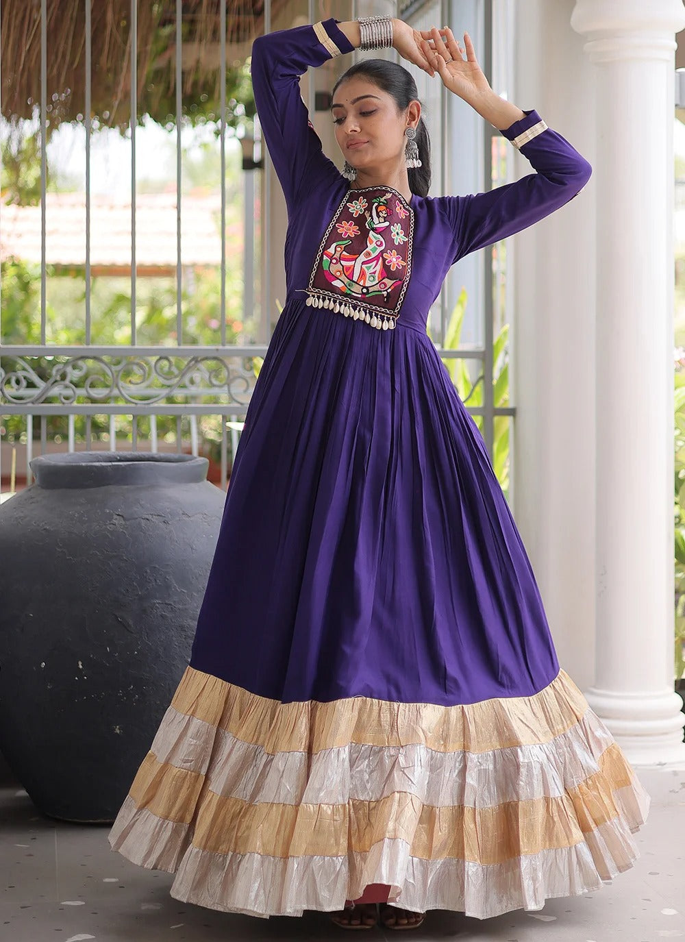 Purple traditional Navratri gown with Gamthi work and four layered flared stitching