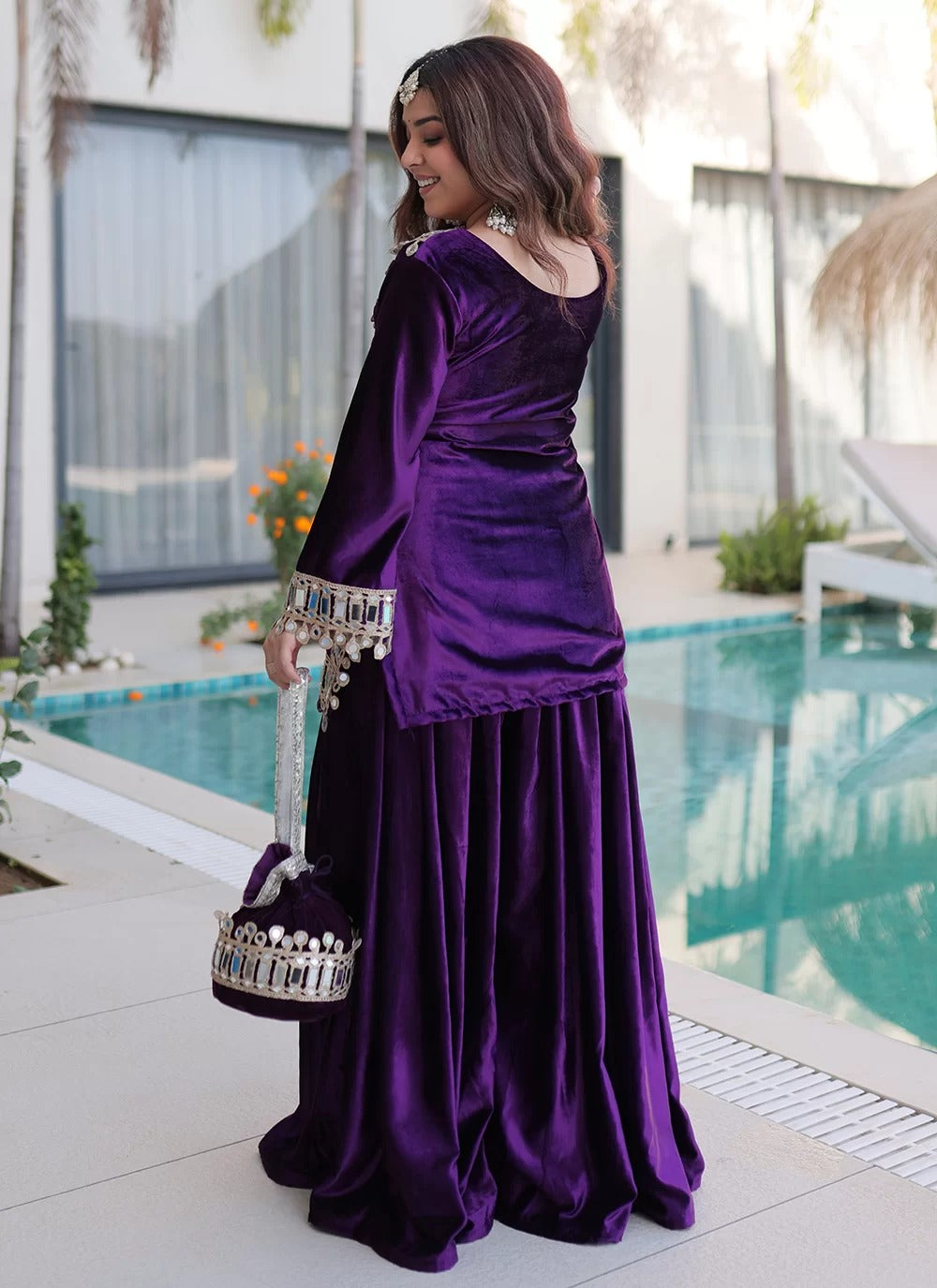 Mirror work velvet palazzo suit in purple ice velvet with zari embroidery