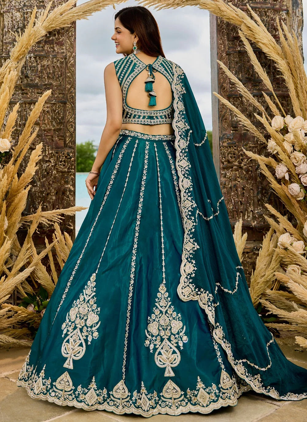 Premium Rama green silk lehenga set with embroidered sweetheart blouse and matching silk dupatta.