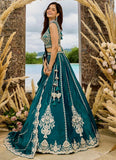 Designer Rama silk lehenga with 4-metre flair, heavy embroidery and elegant festive styling.