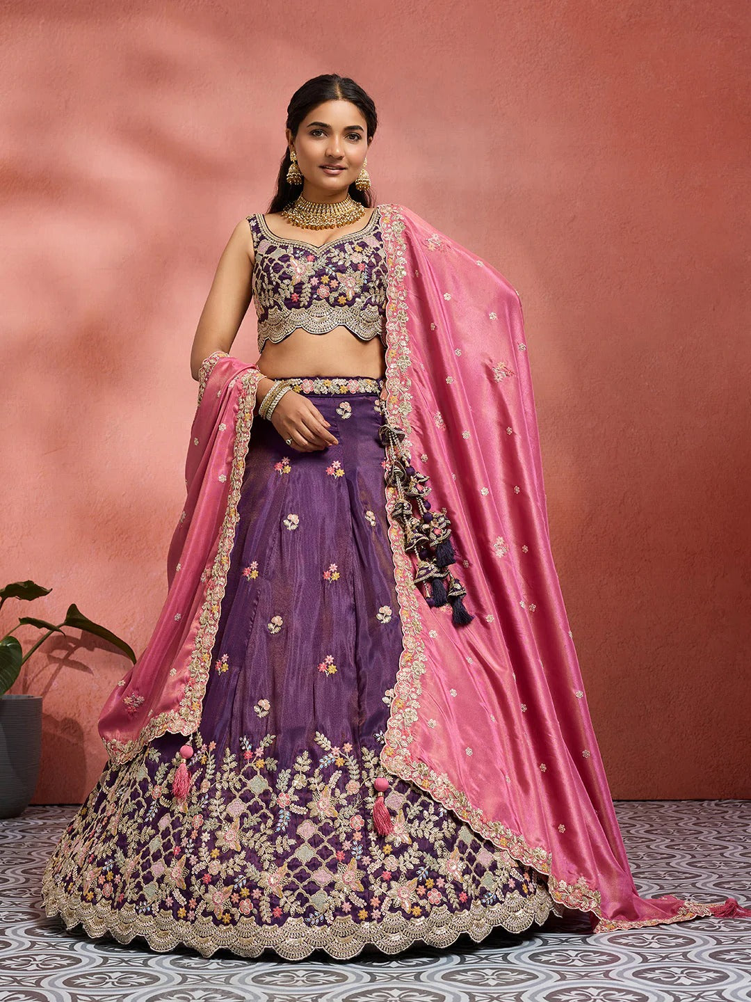 Purple wedding guest lehenga with pink tissue dupatta