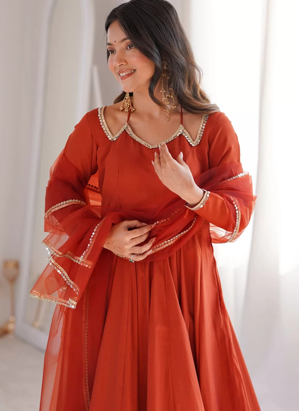 Rust Roman Silk Chanderi Anarkali suit with net dupatta