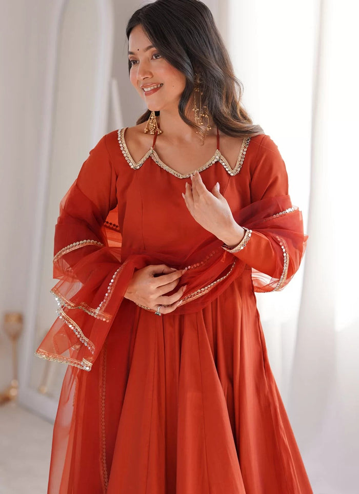 Rust Roman Silk Chanderi Anarkali suit with net dupatta