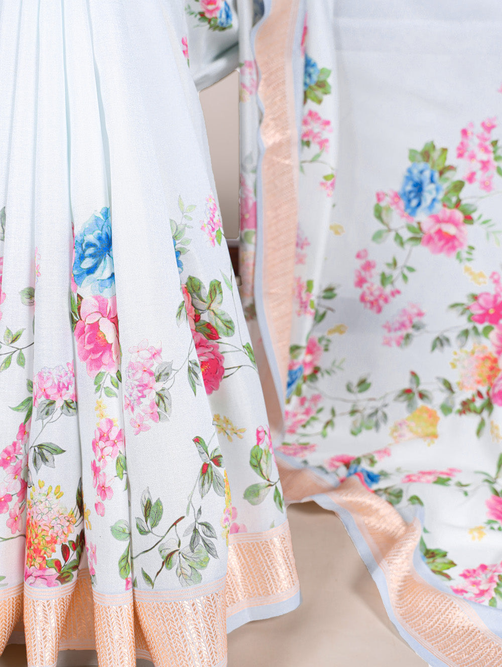 Floral printed sky blue saree with wine blouse