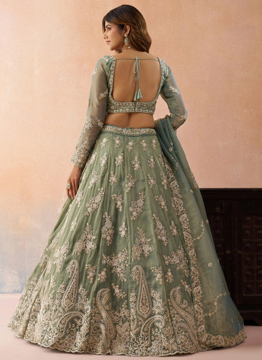 Designer sea green lehenga set featuring an embroidered sweetheart blouse and matching tissue dupatta