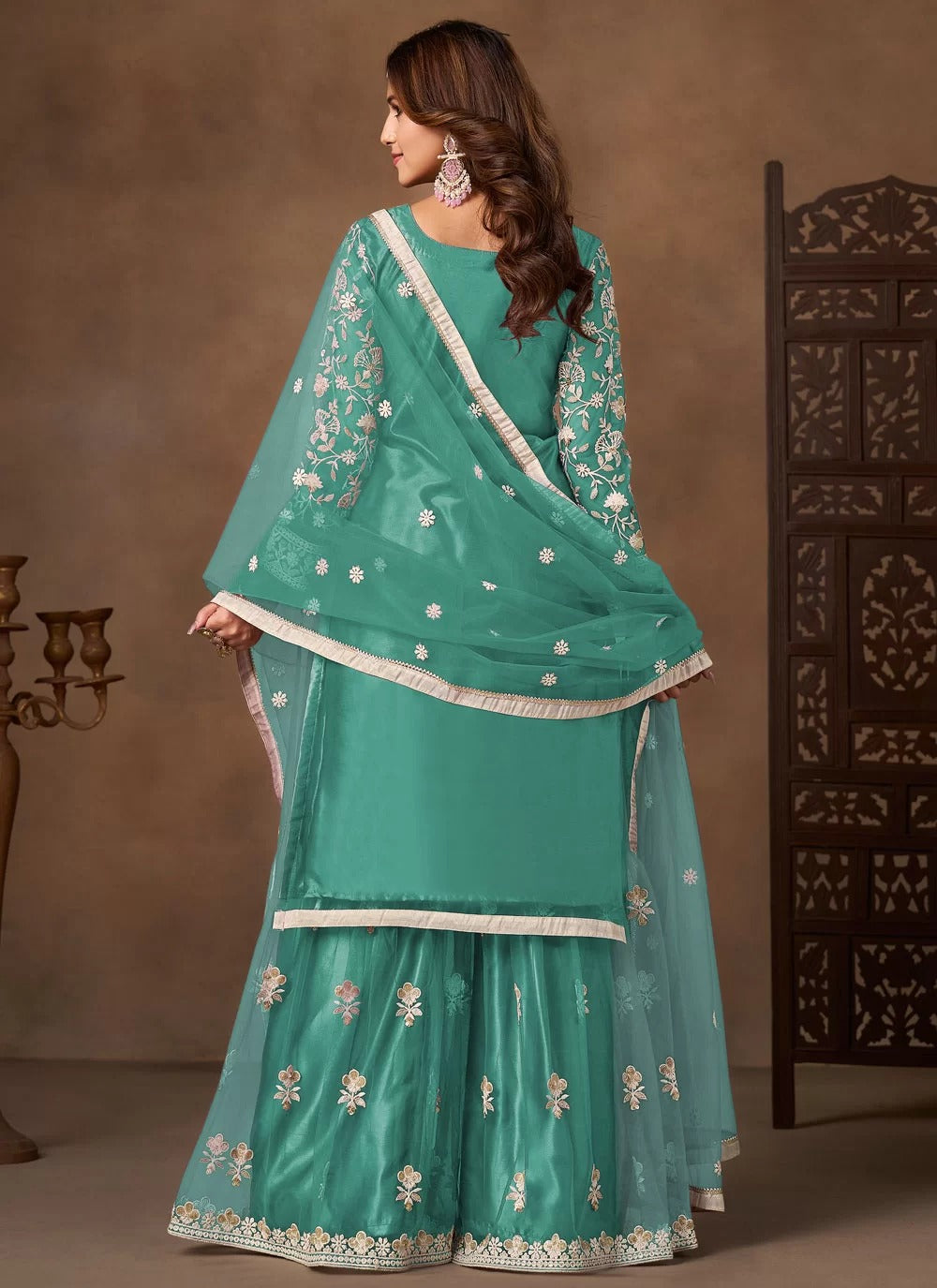 Sea green net embroidered palazzo salwar suit with satin inner and matching dupatta
