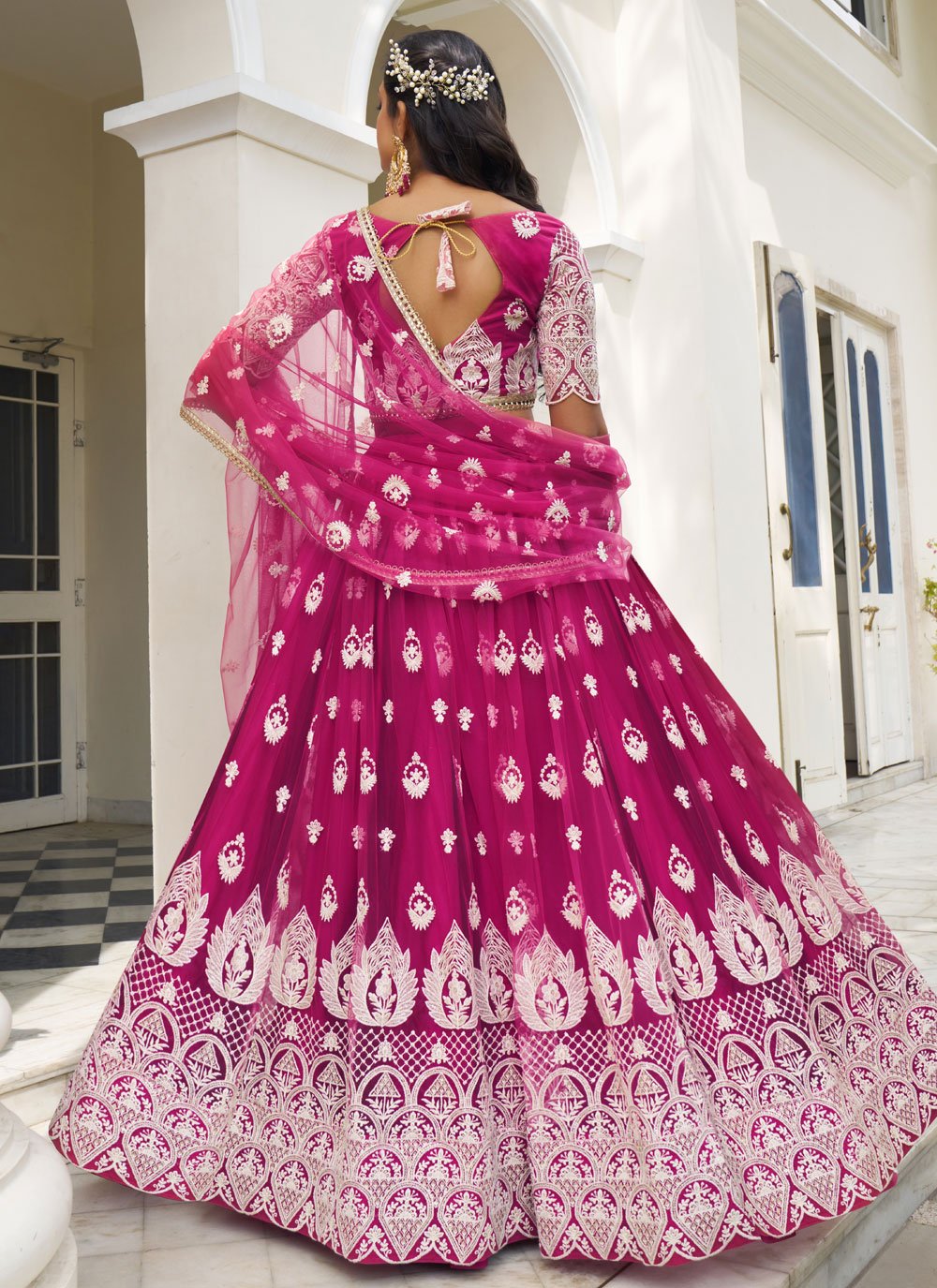 Stunning Dark Pink Butterfly Net Embroidered Party Wear Lehenga Set