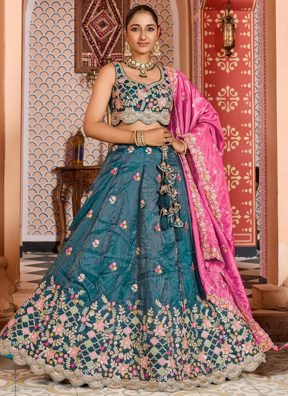 Designer teal wedding guest lehenga with pink dupatta